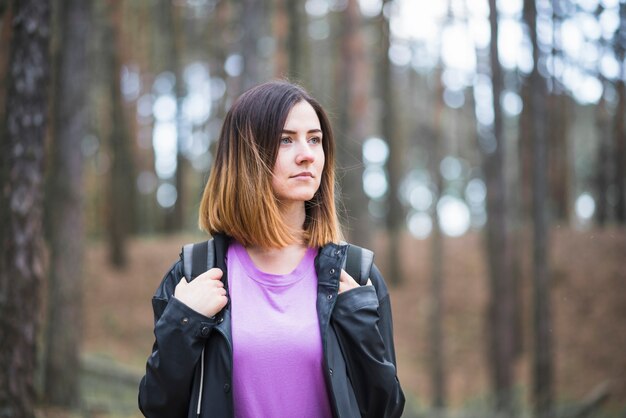 Young woman in calm forest