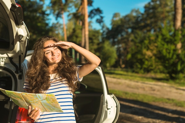 Free photo young woman on a car trip