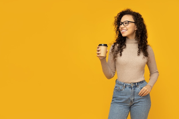 Young woman in casual wearing on yellow background