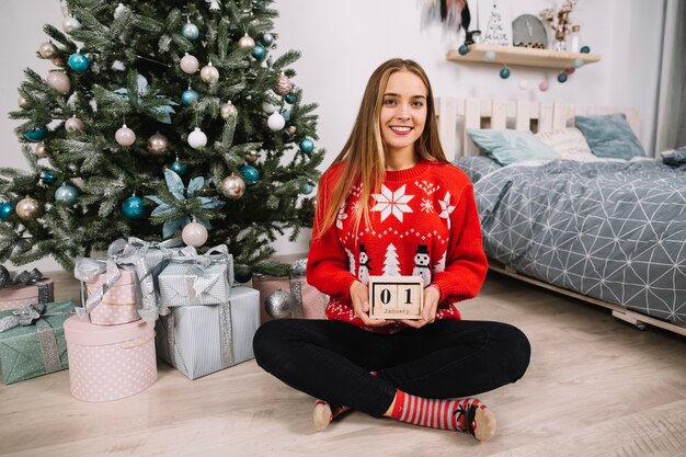 Young woman celebrating christmas at home