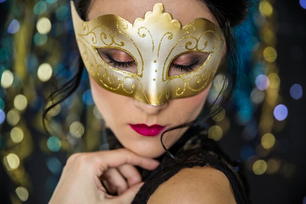 Young woman celebrating venetian carnival