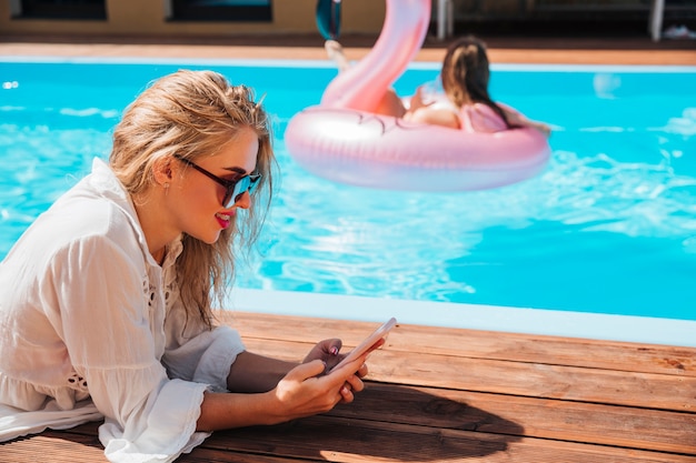 Young woman checking her phone