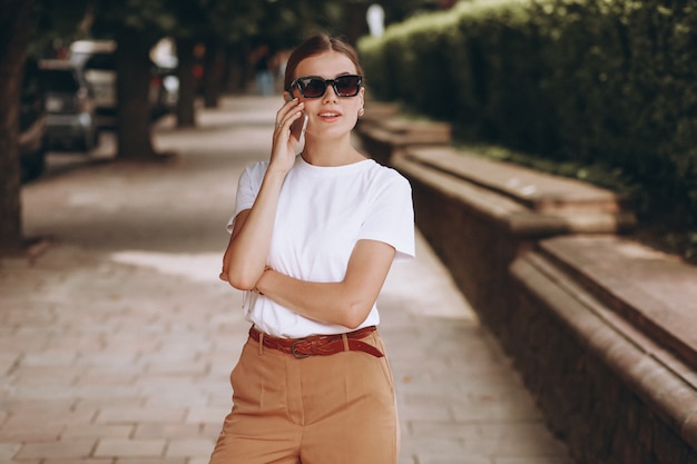 Young woman in city center talking on phone