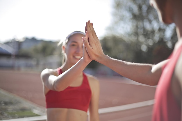 young woman claps her hand to her partner