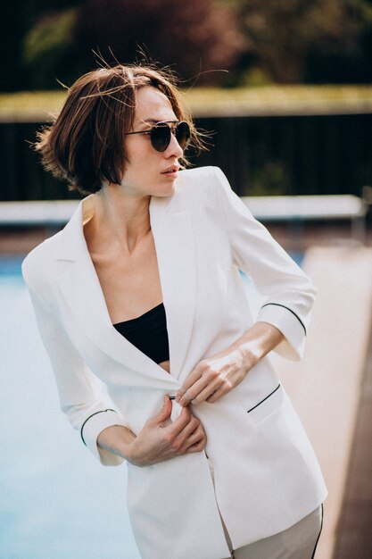 Young woman in classy white business suit