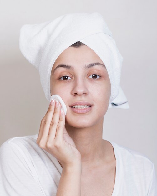 Young woman cleaning face process
