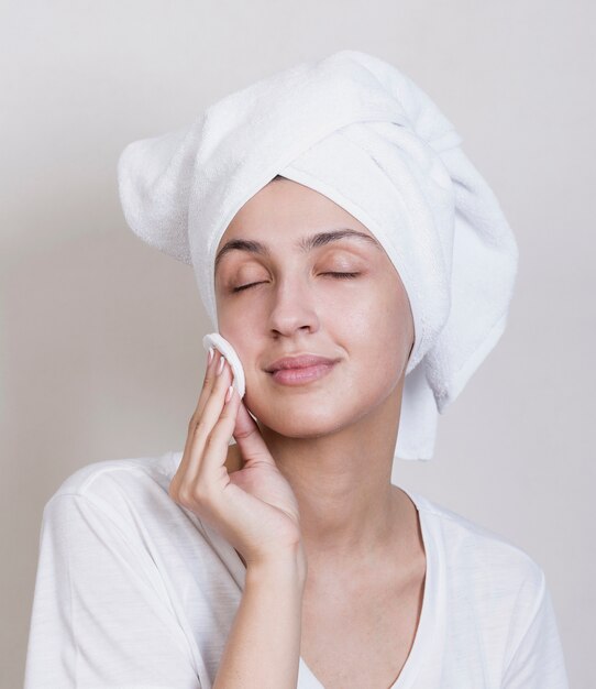 Young woman cleaning face process