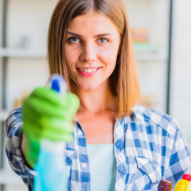 Free photo young woman cleaning the house