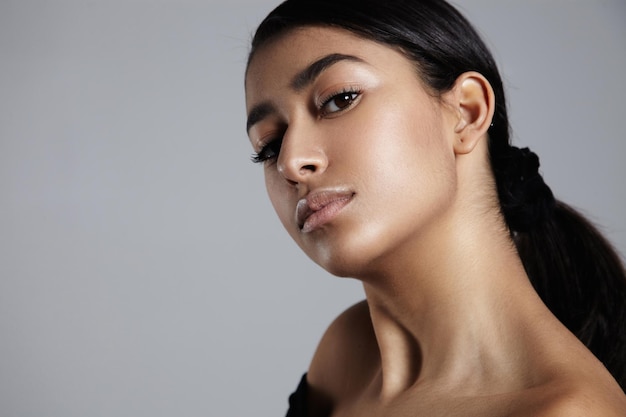 Young woman closeup portrait showing her ideal skin