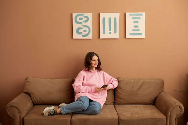 Young woman connected to her smartphone