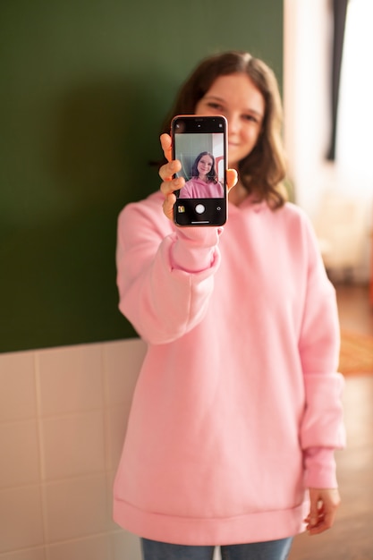 Young woman connected to her smartphone