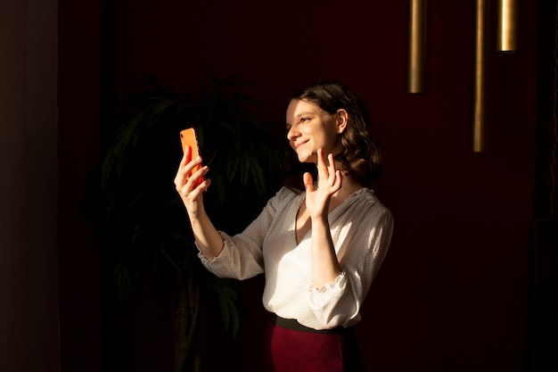 Young woman connected to her smartphone