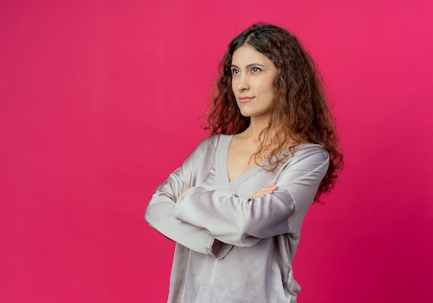 young woman crossing hands isolated on pink