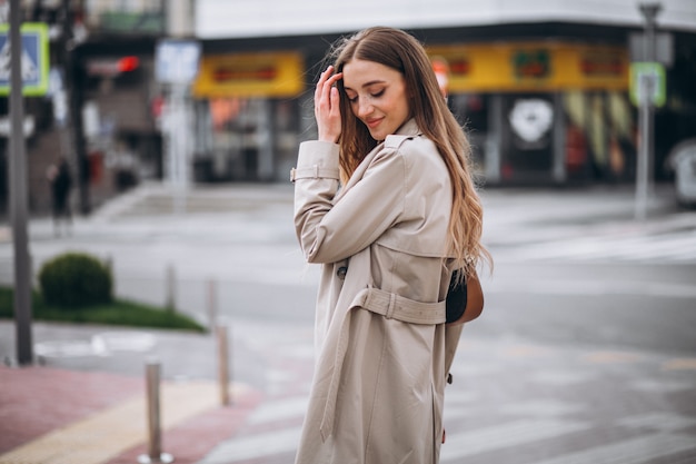 Young woman at the crosswalk in the city center