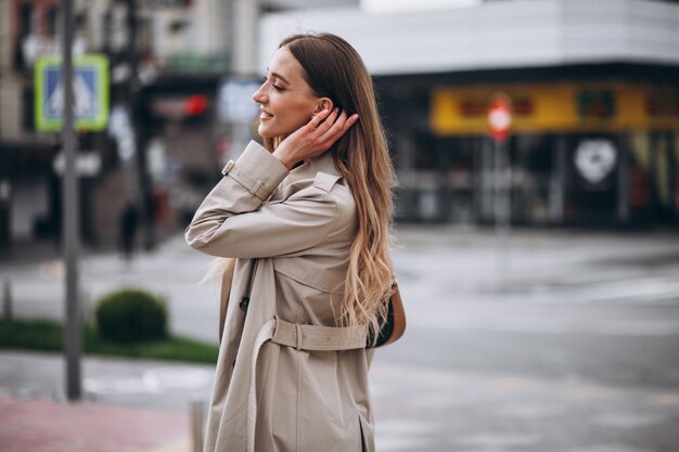 Young woman at the crosswalk in the city center