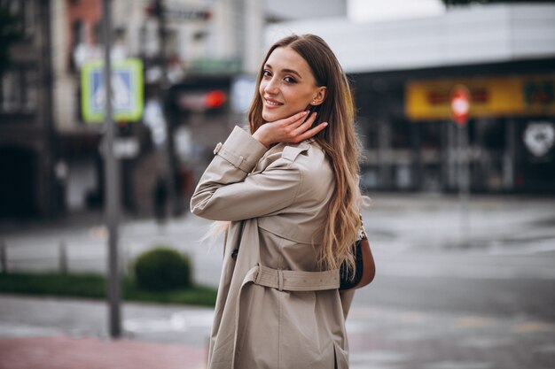 Young woman at the crosswalk in the city center