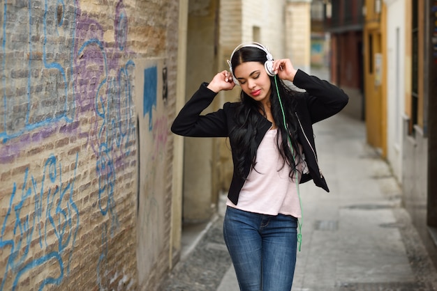 Young woman dancing while listening to music