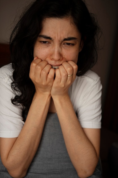 Free photo young woman dealing with anxiety