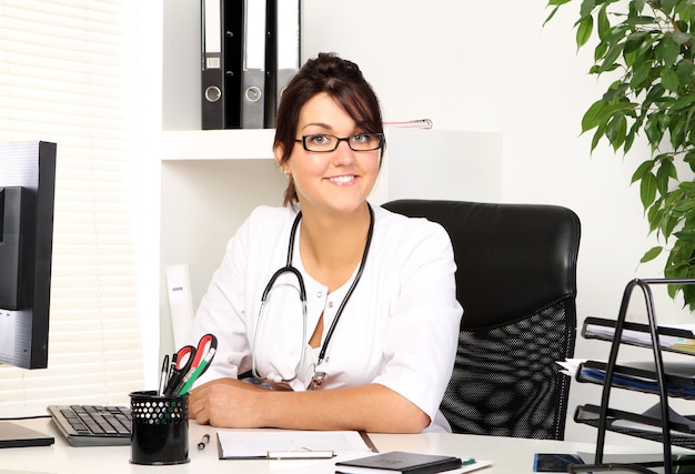 Young woman doctor in her office