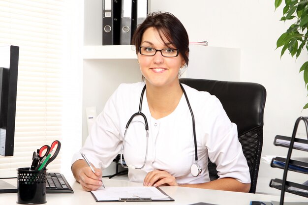 Young woman doctor in her office