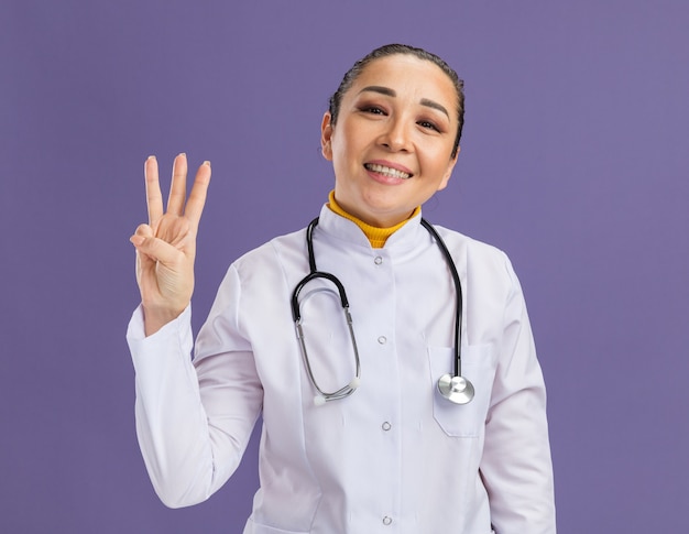 Free Photo | Young beautiful woman doctor wearing white coat with ...