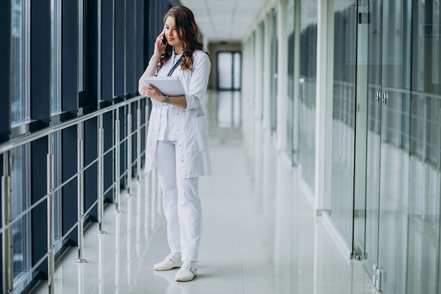 Young woman doctor with stethoscope at hospital