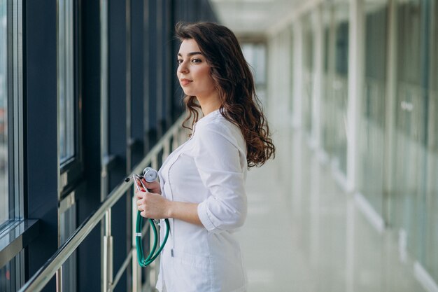 Young woman doctor with stethoscope at hospital