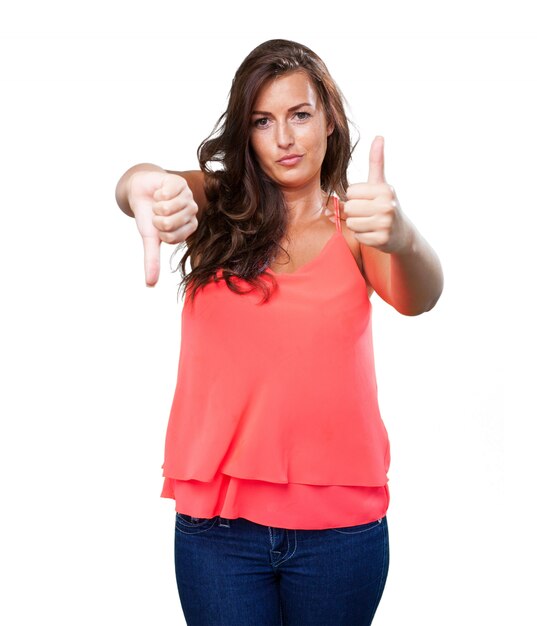 young woman doing a contradictory gesture