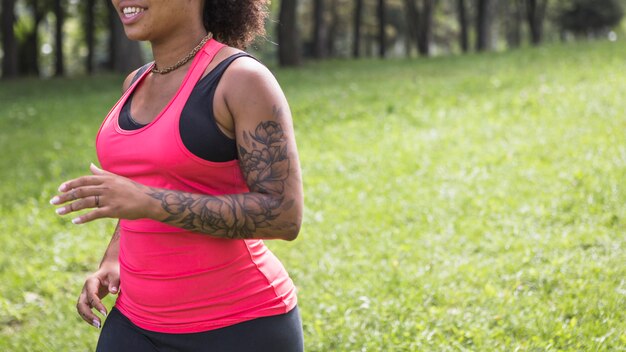 Young woman doing exercise in the park