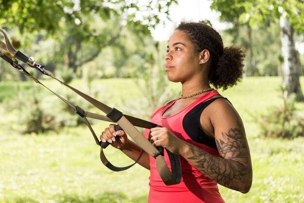 Young woman doing exercise in the park