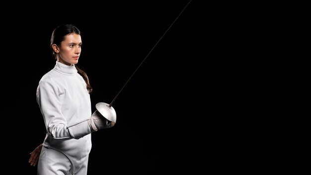 Young woman doing fencing