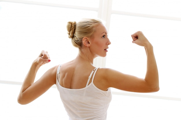 Young woman doing fitness exircises