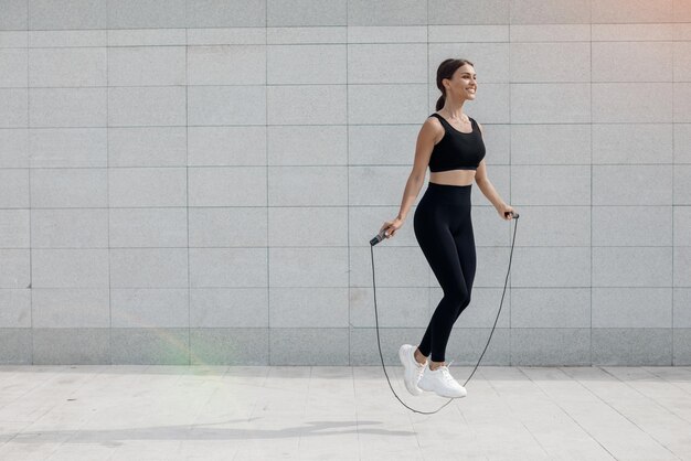 Young woman doing fitness outdoor