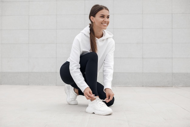 young woman doing fitness outdoor