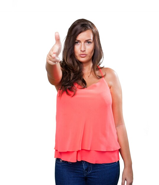 young woman doing a gun gesture