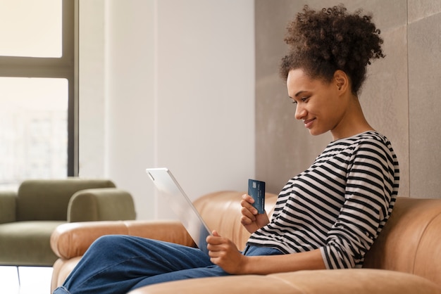 Young woman doing her shopping online