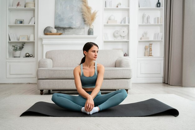 Young woman doing her workout at home