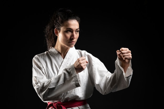 Free photo young woman doing karate