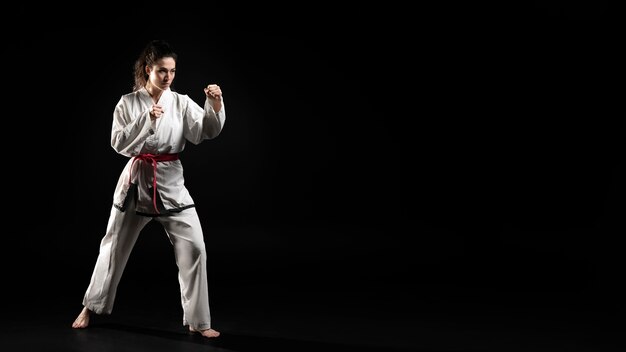 Young woman doing karate