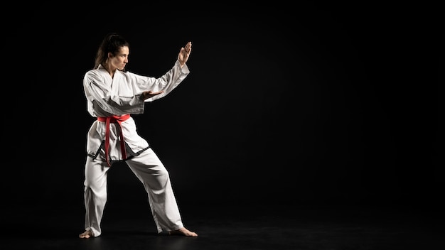 Young woman doing karate