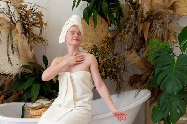 Free photo young woman doing a self care treatment