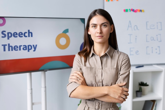 Young woman doing speech therapy for kids