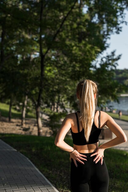 young woman doing sport in the park
