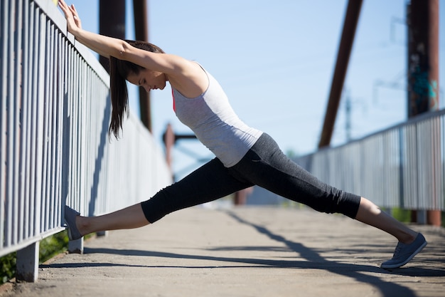 Young woman doing stretching exercises