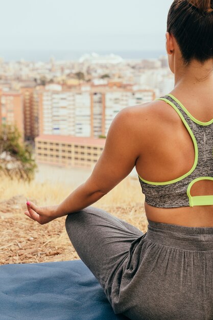 Young woman doing yoga and meditating