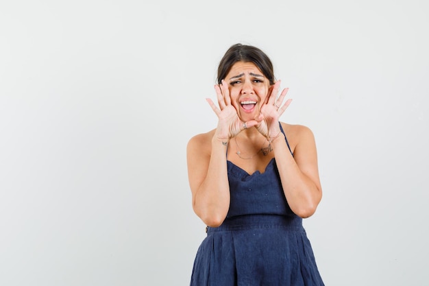Excited Young Woman in Dress Shouting with Joy – Free Stock Photo