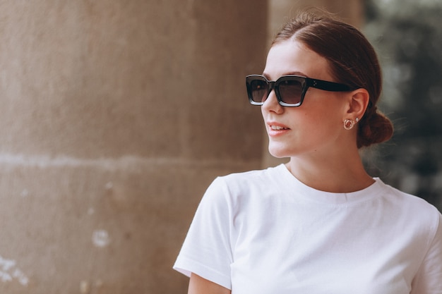 Young woman dressed casual outside in town