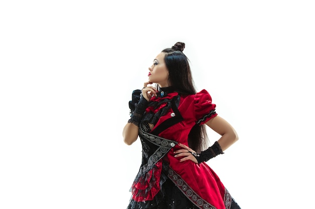 The young woman dressed in medieval style posing at studio as marquise. Fantasy, Antique, Renaissance concept