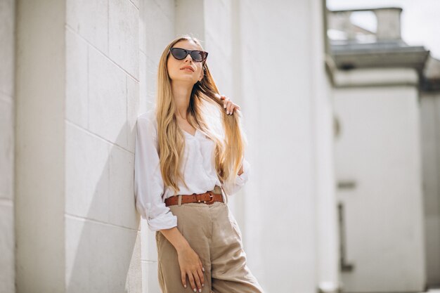 Young woman dressed in summer outfit out in the city