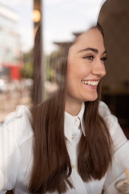 young woman drinking iced coffee